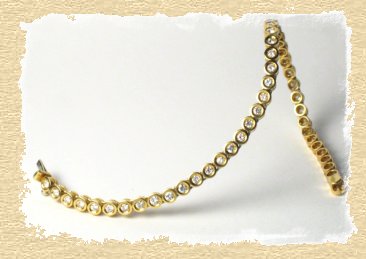 "Rivierenband" aus 750/Gelbgold mit Diamanten